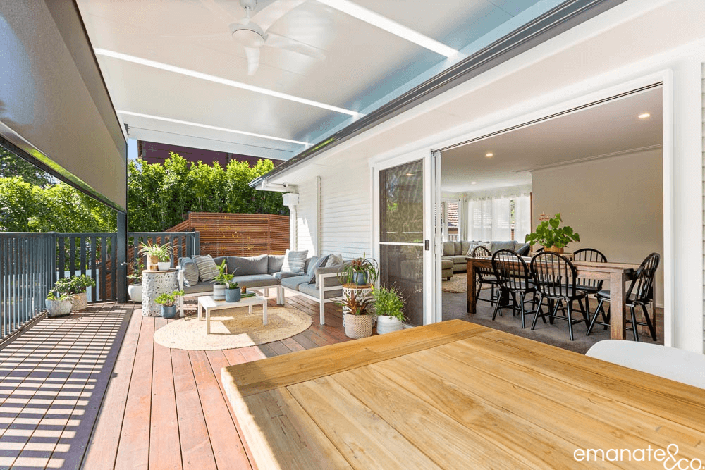 Rear aluminium stacker doors leading out from the living room to alfresco outdoor patio cover & timber deck in Thornleigh