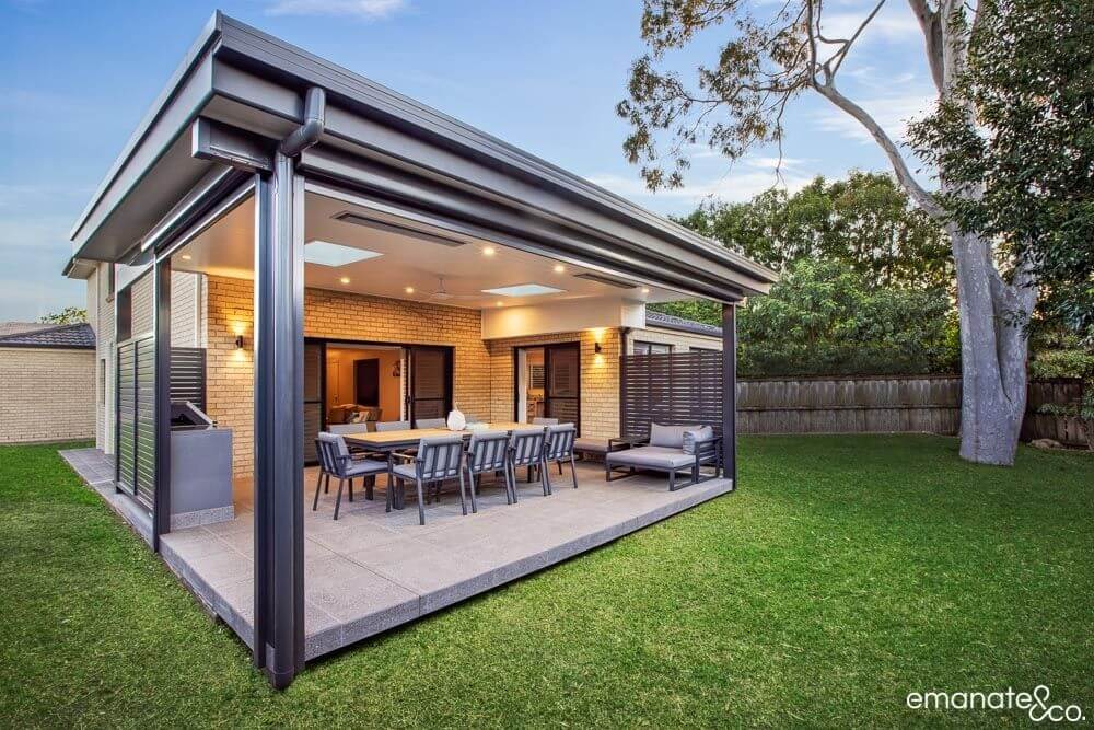 "Spacious tiled alfresco outdoor living space with dining and lounge areas in West Pennant Hills."